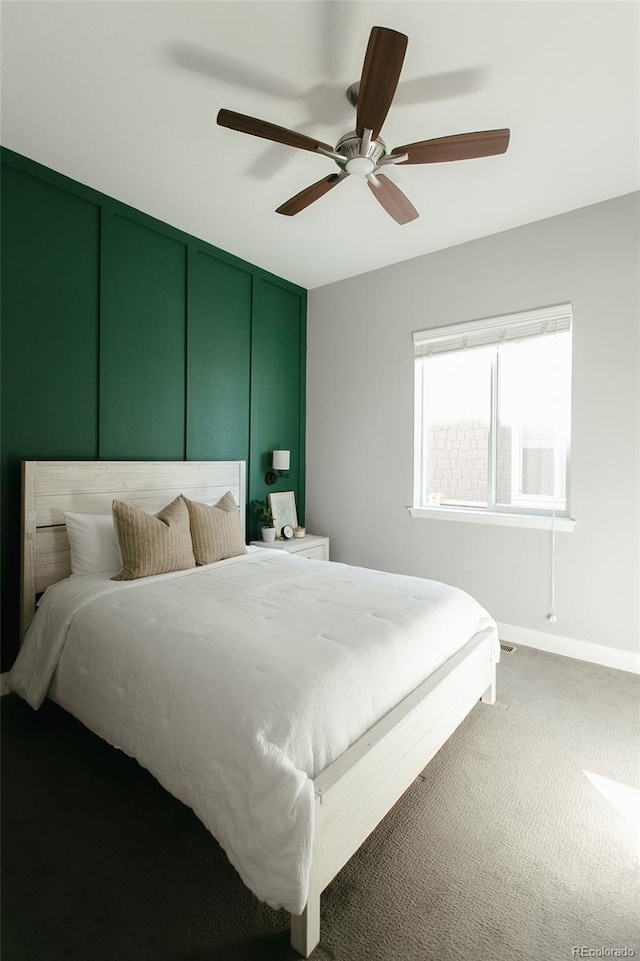 carpeted bedroom featuring ceiling fan