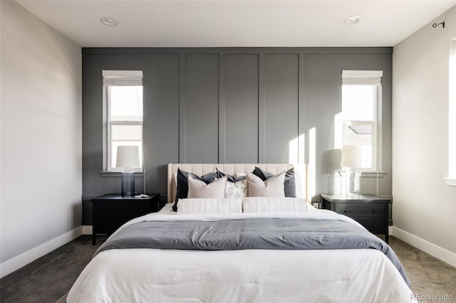 bedroom with carpet flooring and multiple windows