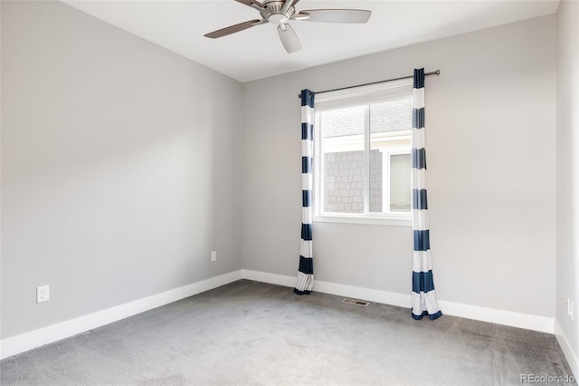 unfurnished room featuring light colored carpet and ceiling fan