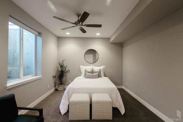 bedroom with dark colored carpet and ceiling fan