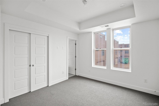 unfurnished bedroom with carpet flooring and a closet