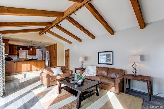 living room with vaulted ceiling with beams