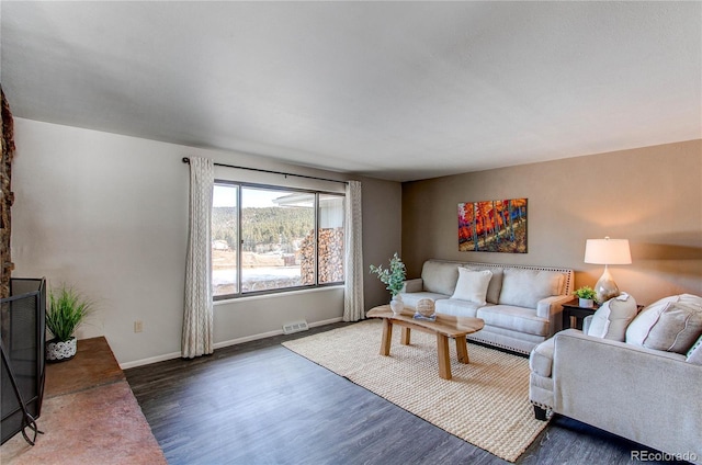 living room featuring dark hardwood / wood-style flooring