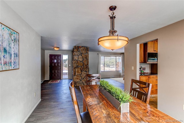 dining room with dark wood-type flooring