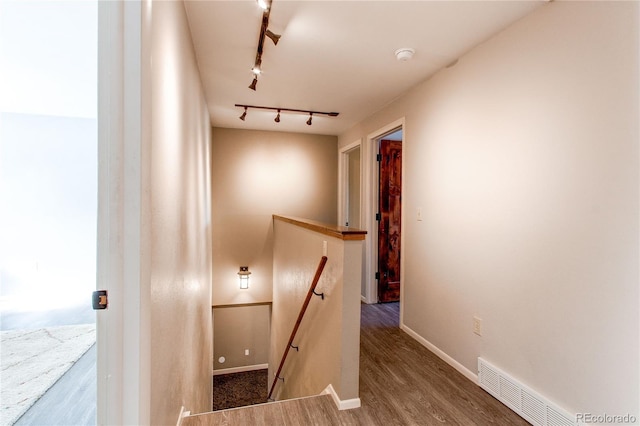 interior space featuring hardwood / wood-style flooring and rail lighting