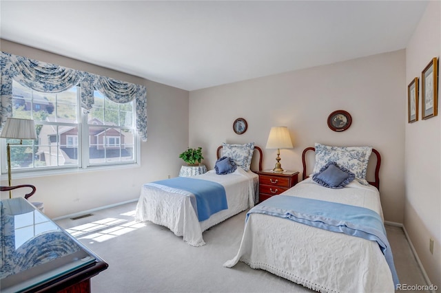 bedroom featuring multiple windows and carpet floors