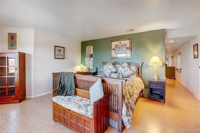 bedroom with light wood-type flooring