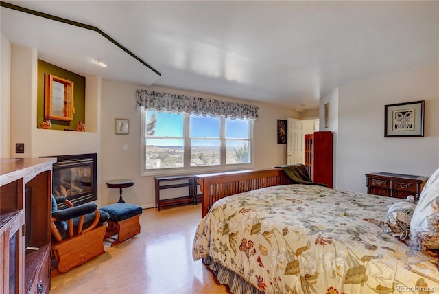 bedroom with light hardwood / wood-style floors