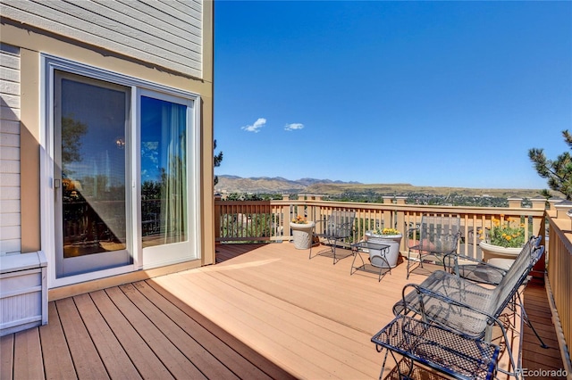 wooden deck featuring a mountain view