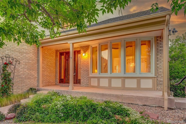 entrance to property with a porch