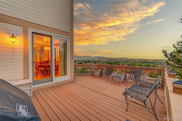 deck at dusk with a mountain view