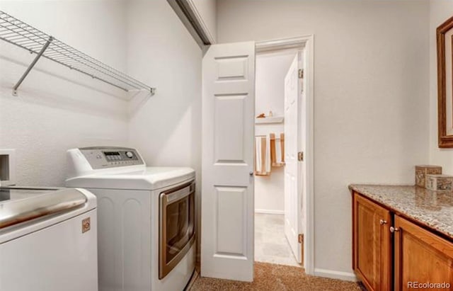 washroom with washer and clothes dryer