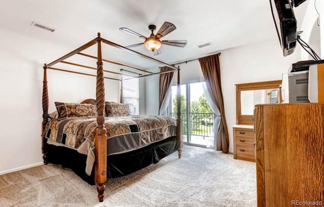 carpeted bedroom with ceiling fan and access to exterior