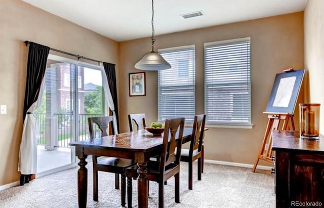 view of carpeted dining space