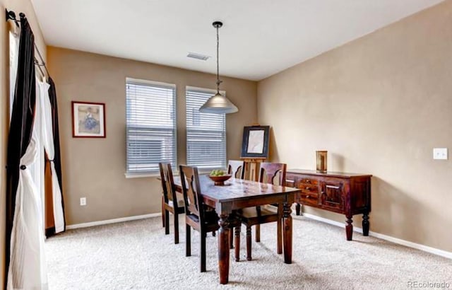 view of carpeted dining space