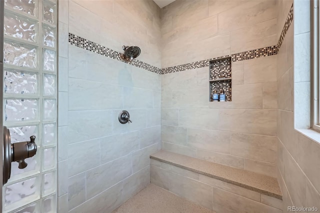 full bathroom featuring tiled shower