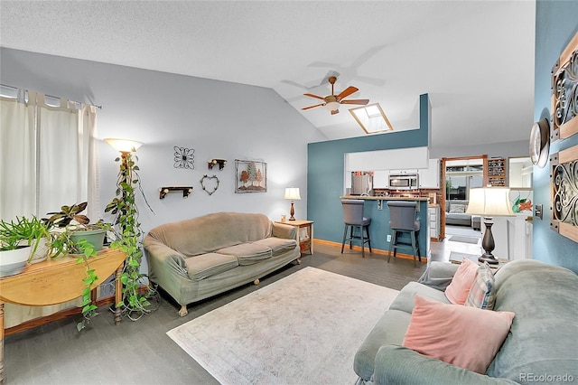 5323 E Sandpiper Ave, Castle Rock, CO 80104 - living room featuring ceiling fan, wood finished floors, lofted ceiling, and baseboards