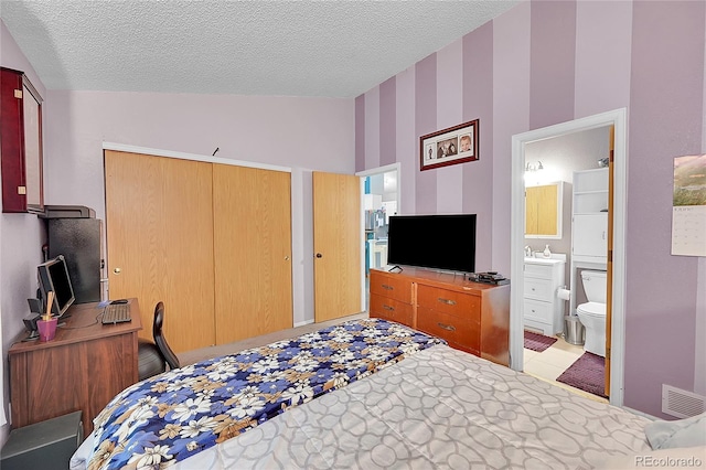 5323 E Sandpiper Ave, Castle Rock, CO 80104 - bedroom with a closet, a textured ceiling, wallpapered walls, a sink, and an office area