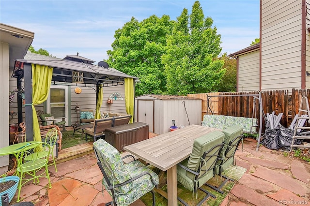 5323 E Sandpiper Ave, Castle Rock, CO 80104 - deck featuring a gazebo, outdoor dining area, a fenced backyard, an outdoor living space, and a patio area