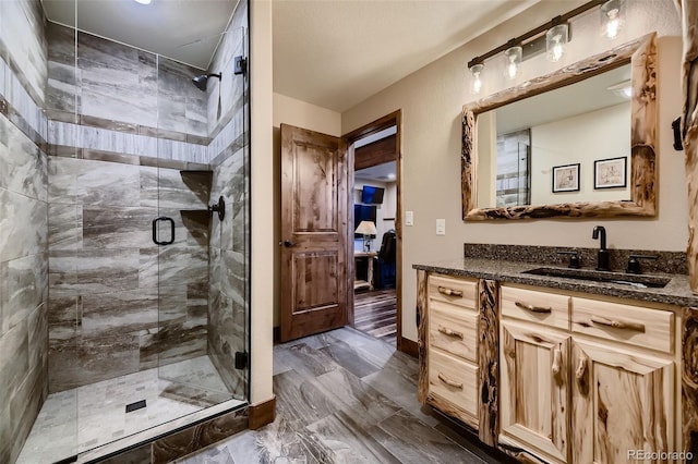 13116 S Noka Trl, Pine, CO 80470 - bathroom featuring a stall shower, vanity, and marble finish flooring