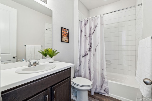 bathroom with toilet, shower / tub combo, wood finished floors, and vanity