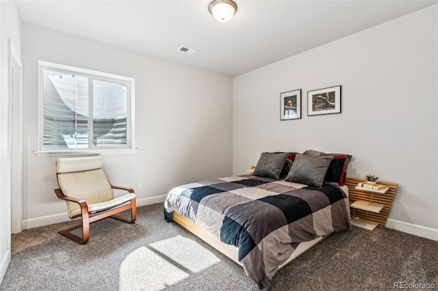 bedroom featuring baseboards, visible vents, and carpet floors