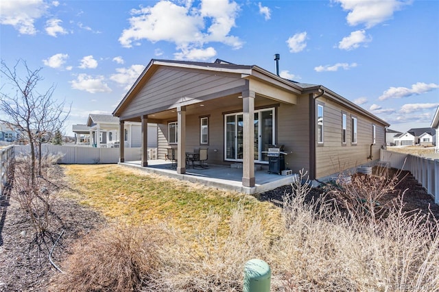 back of house with a patio area and a fenced backyard