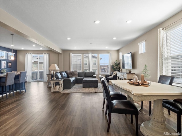 dining space with dark hardwood / wood-style floors