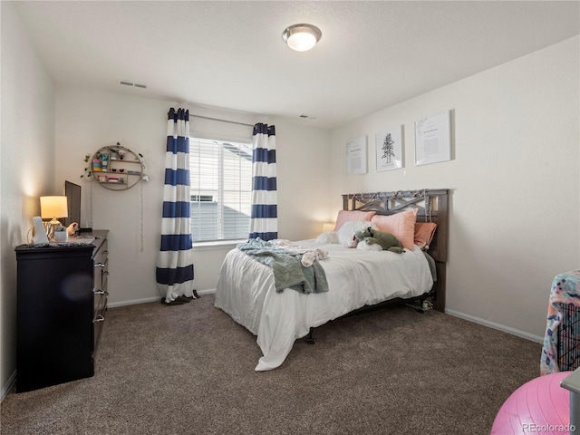 bedroom featuring dark colored carpet