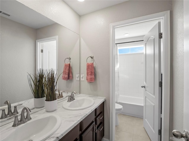 full bathroom with tile patterned floors, vanity, toilet, and washtub / shower combination