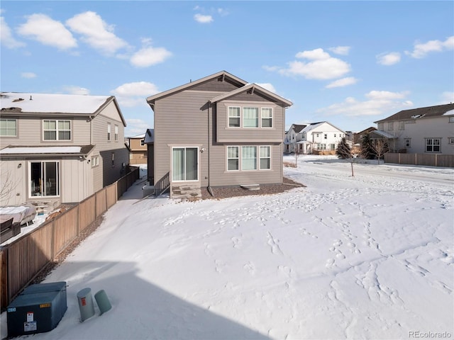 view of snow covered house