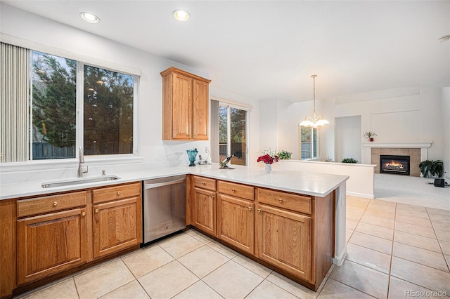 5607 S Gray St, Littleton, CO 80123 - kitchen with a sink, light tile patterned floors, dishwasher, and a peninsula