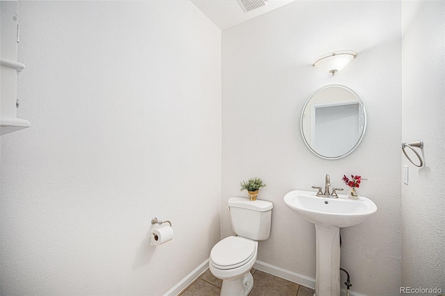 5607 S Gray St, Littleton, CO 80123 - bathroom with toilet, tile patterned floors, visible vents, and baseboards