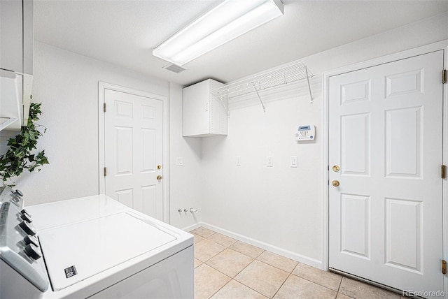 5607 S Gray St, Littleton, CO 80123 - clothes washing area featuring laundry area, visible vents, washing machine and clothes dryer, light tile patterned floors, and baseboards