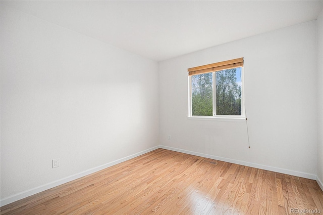 5607 S Gray St, Littleton, CO 80123 - empty room with baseboards and light wood finished floors