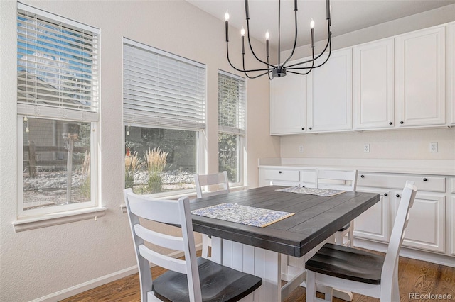 11973 Song Bird Hills St, Parker, CO 80138 - dining space with a chandelier, wood finished floors, and a textured wall