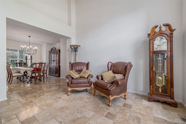 11973 Song Bird Hills St, Parker, CO 80138 - living area with stone tile flooring, a chandelier, and a high ceiling