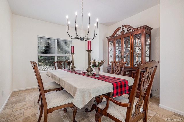 11973 Song Bird Hills St, Parker, CO 80138 - dining area with stone tile floors and a chandelier