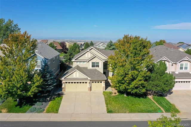 11973 Song Bird Hills St, Parker, CO 80138 - traditional-style home with concrete driveway, a residential view, a front yard, and stone siding