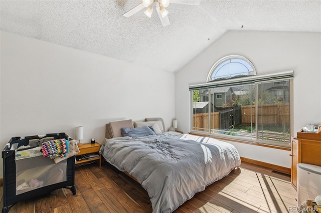 6980 Native Cir, Colorado Springs, CO 80919 - bedroom featuring lofted ceiling, a textured ceiling, hardwood / wood-style flooring, and ceiling fan