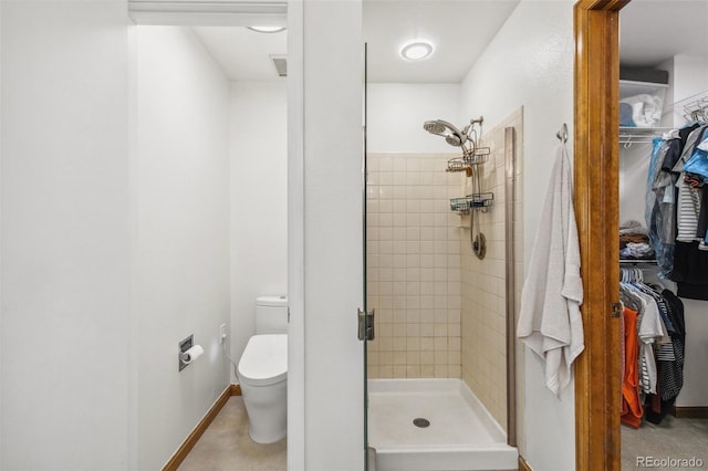 6980 Native Cir, Colorado Springs, CO 80919 - full bathroom featuring a shower stall, toilet, and a spacious closet
