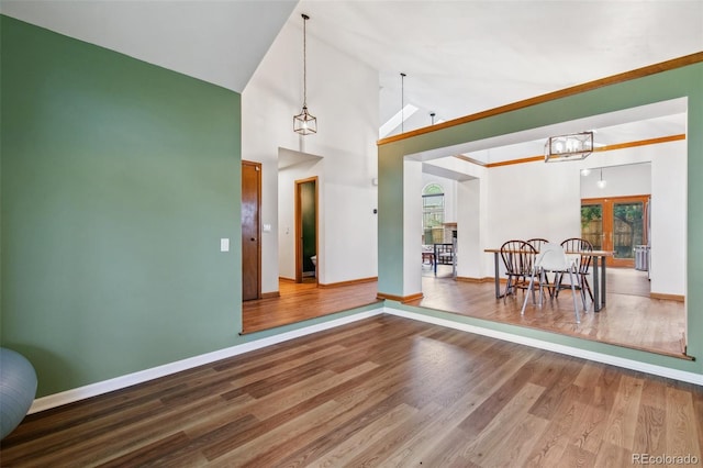 6980 Native Cir, Colorado Springs, CO 80919 - dining room featuring plenty of natural light, wood finished floors, baseboards, and high vaulted ceiling