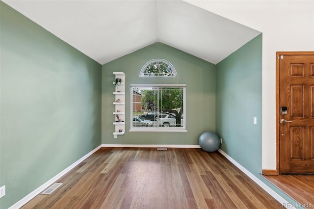 6980 Native Cir, Colorado Springs, CO 80919 - workout area featuring wood finished floors, vaulted ceiling, and baseboards