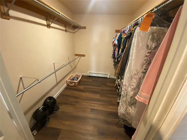 7079 Estes Dr, Arvada, CO 80004 - walk in closet with baseboard heating and wood finished floors