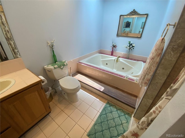7079 Estes Dr, Arvada, CO 80004 - bathroom featuring a jetted tub, toilet, tile patterned floors, and vanity