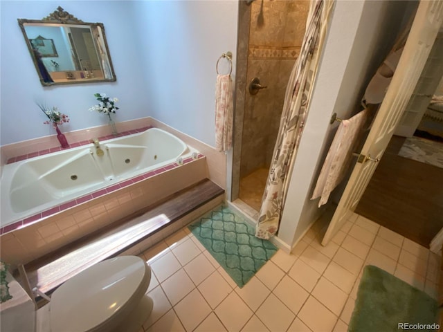 7079 Estes Dr, Arvada, CO 80004 - bathroom with a stall shower, a whirlpool tub, tile patterned flooring, and toilet