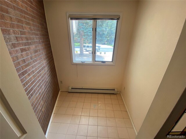 7079 Estes Dr, Arvada, CO 80004 - spare room with baseboard heating and light tile patterned floors