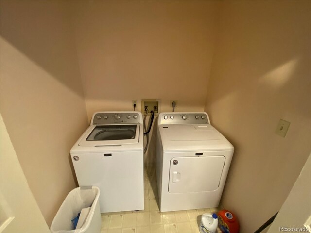 7079 Estes Dr, Arvada, CO 80004 - laundry area featuring separate washer and dryer