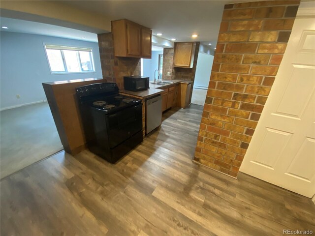 7079 Estes Dr, Arvada, CO 80004 - kitchen featuring black appliances, a sink, dark wood-type flooring, tasteful backsplash, and baseboards