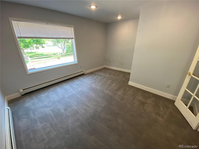 7079 Estes Dr, Arvada, CO 80004 - spare room featuring baseboard heating, dark colored carpet, a baseboard heating unit, baseboards, and recessed lighting